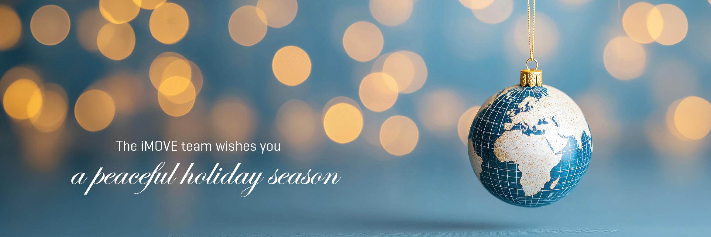 Christmas bauble with world map, text: The iMOVE team wishes you a peaceful holiday season