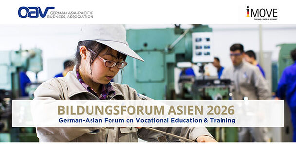 A young Chinese woman in a training workshop files a workpiece that is clamped in a vice